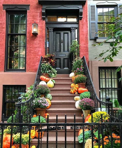 Mums And Pumpkins Of All Shapes And Sizes Decorate This Brownstones