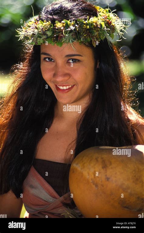 Portrait Of A Part Hawaiian Woman In A Haku Lei Sitting With A Ipuheke Gourd Hula Implement