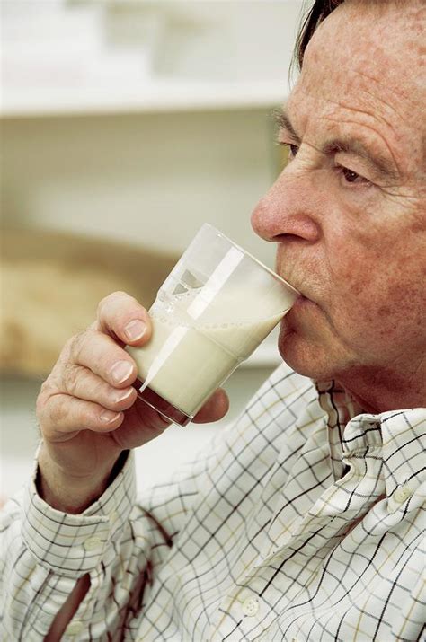 Elderly Man Drinking Milk Photograph By Lea Patersonscience Photo