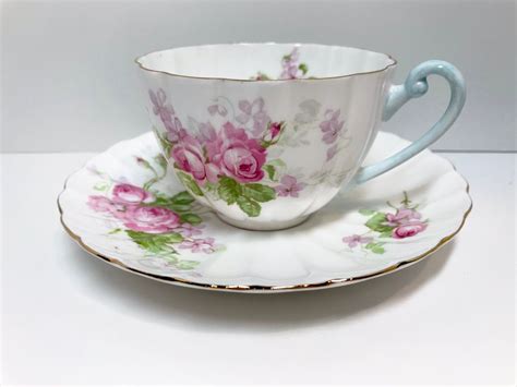 Shelley Rose Tea Cup And Saucer White Teacup With Pink Roses And Purple Flowers Ludlow Shape