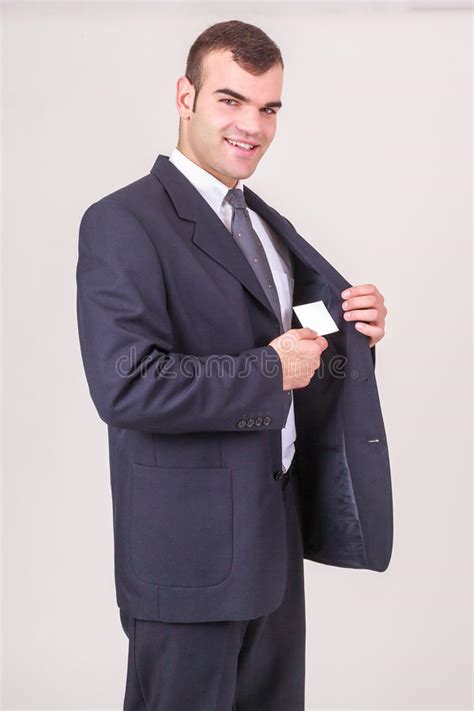 Smiling Businessman Takes A Business Card Out Of His Jacket Stock Image