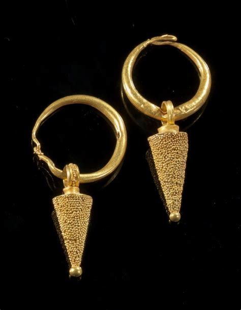 Pair Of Gold Earrings With A Bow And A Pendant In Form Of A Cone With