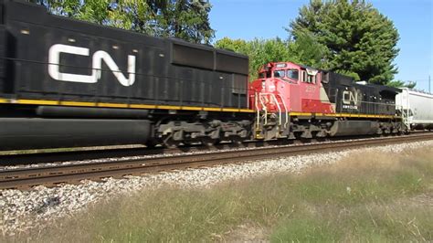Cn 5791 Cn 2517 Rolling West With A Train Of Hoppers Tank Cars Ttx