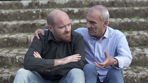 Father Talking And Consoling Her Son Who Lost His Job