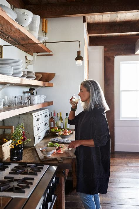 Senior Woman Cooking In Kitchen By Stocksy Contributor Trinette Reed Stocksy