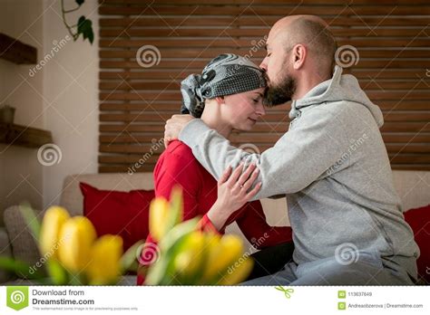 Supportive Husband Kissing His Wife Cancer Patient After Treatment In Hospital Cancer And
