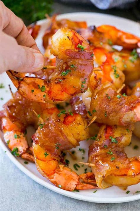 Not only is this appetizer absolutely perfect with a dry martini, but everyone will also flock to the platter and sing. Sweet and Savory Bacon Wrapped Shrimp | The Recipe Critic