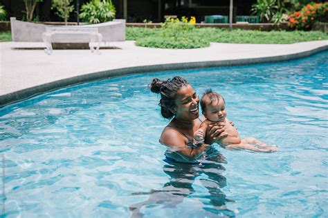 Happy Mother And Baby In Pool By Stocksy Contributor Diane
