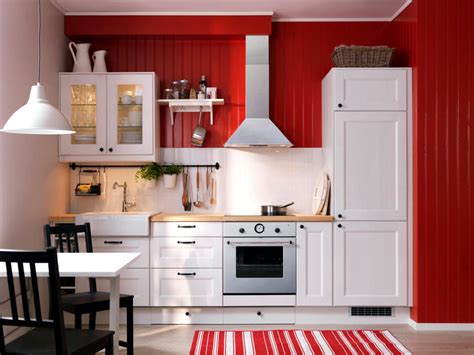 In this farmhouse kitchen, antique hutchlike cabinetry painted a soft shade of red make a scintillating splash. White country kitchen me wood panels painted red ...