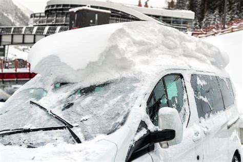 Car On A Street Covered With Big Thick Snow Layer After Heavy Snowfall