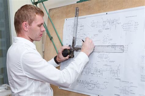 Engineer Making A Blueprint Project With Drawing Board Stock Image