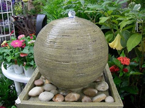Influenced by the simple fountains found in japanese gardens, this water feature uses a length of bamboo supported on two narrower lengths of bamboo to gently trickle water into a ceramic basin filled with gravel. Sphere Water Features For Your Garden That Will Steal The Show