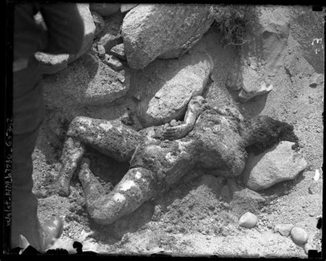 Body of Nina Lee Deloney; caked in dirt, laying in swallow ...
