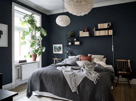 Design a room that includes modern and rustic touches. Dark blue Scandinavian bedroom in 2020 | Bedroom decor ...