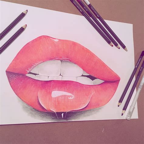 A Drawing Of A Womans Lips With Two Pencils Next To It On A Piece Of Paper