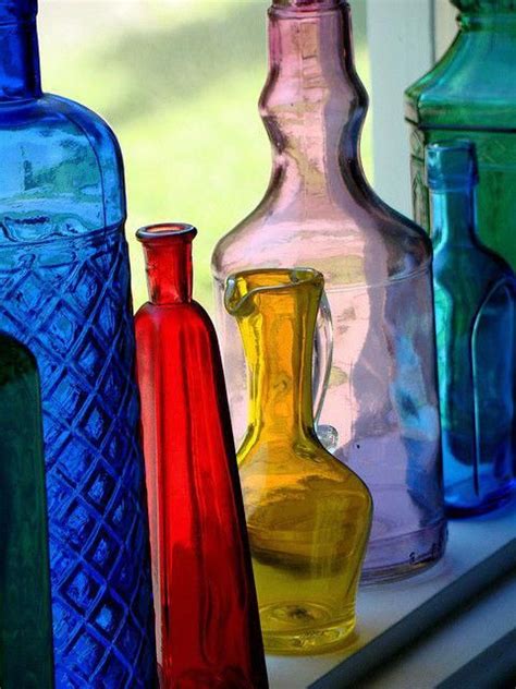 Colorful Bottles Look So Pretty In A Window With The Sunlight Streaming