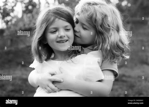 Little Boy And Girl Best Friends Hugging Kids Kissing Each Other With