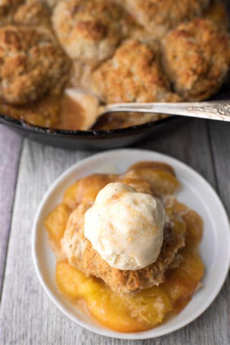This old fashioned peach cobbler recipe is not only extremely easy to make from scratch, but it's made with fresh or canned peaches so you can enjoy it all year round! Easy Peach Cobbler Recipe | Let's Eat Cake