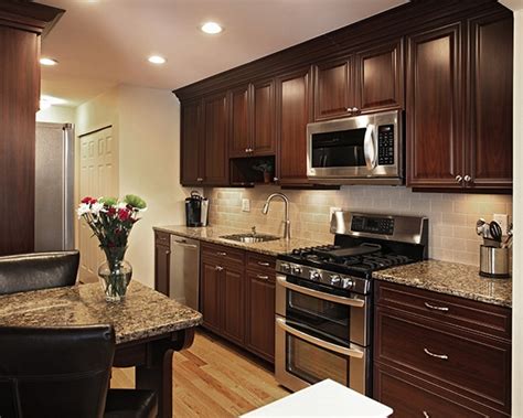 This contemporary portland kitchen utilizes white finishes including the walls, countertops and window frames to reflect natural light and make the space appear larger. How to Pair Countertop Colors with Dark Cabinets