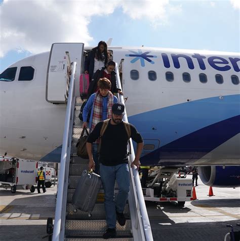 Passengers Getting Off Of Plane In Cancun Travel Off Path