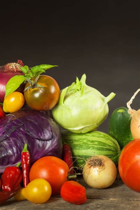 Different Types Of Fresh Vegetables On A Wooden Table Harvesting