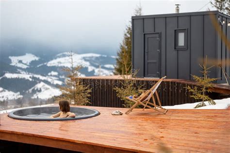Woman Swims In Hot Bath While Resting At Small Modern House In The Mountains Stock Image Image