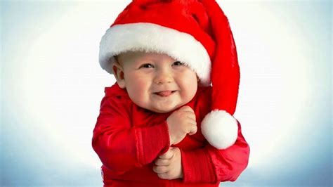 Smiley Cute Baby Boy Is Wearing Santa Claus Dress In White Background