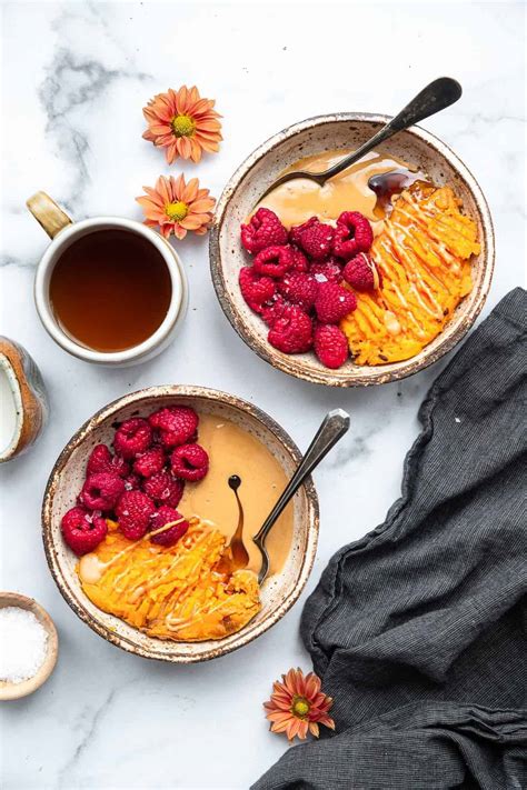 A big healthy buddha bowl with a slightly sweet mango coconut brown rice, sesame roasted sweet potatoes & broccoli, and topped off with an orange sesame almond butter dressing. Paleo Sweet Potato Breakfast Bowl | Food Faith Fitness