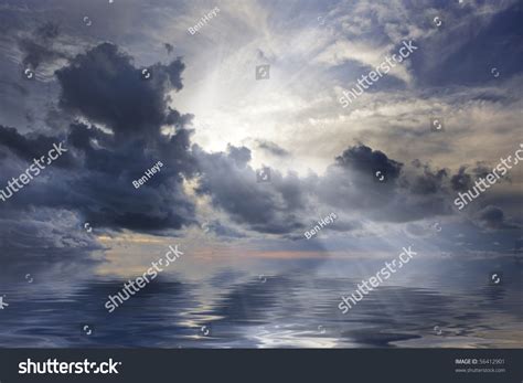 Sun Rays Shining Through Spectacular Clouds Over Ocean