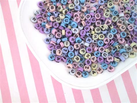 Use alphabet charms to monogram jewelry designs with customer's initials. 100 Pastel 7mm Alphabet Beads Acrylic Pastel Letter Beads ...