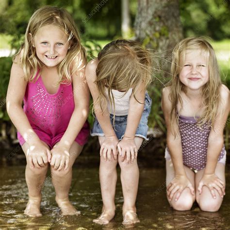 Smiling Girls Playing In Lake Stock Image F0044959 Science Photo Library