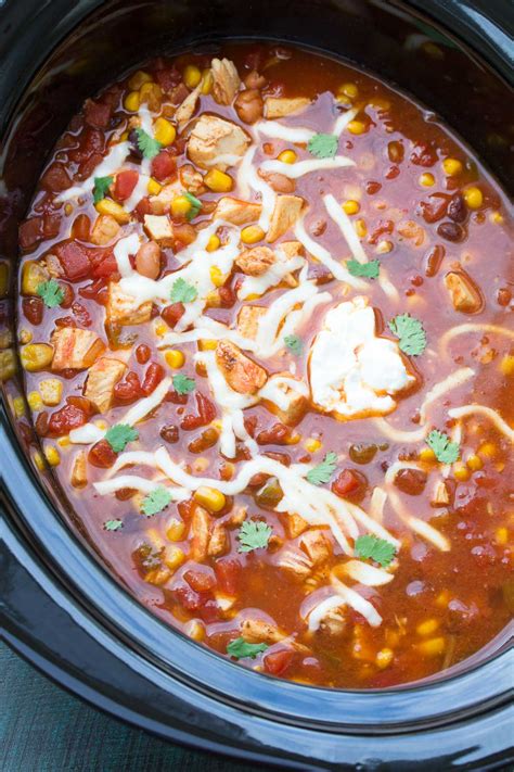 This crockpot chicken taco soup comes together in a matter of minutes, is healthy, gluten free, and full of veggies, lean chicken, plenty of texture, and loads of spices! Easy Slow Cooker Chicken Taco Soup (No Chopping) - Kristine's Kitchen