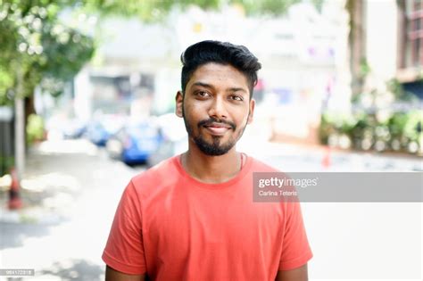 Portrait Of A Young Malaysian Indian Man On The Street High Res Stock