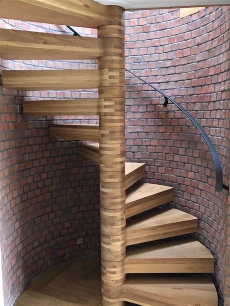Bespoke Floating Spiral Staircase With Steel Treads Clad In Solid Oak