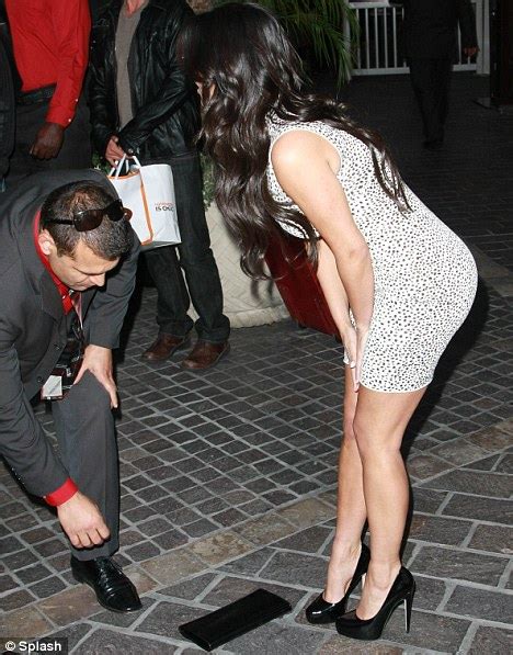 Kim Kardashian Has To Ask For Assistance After She Drops Her Handbag On