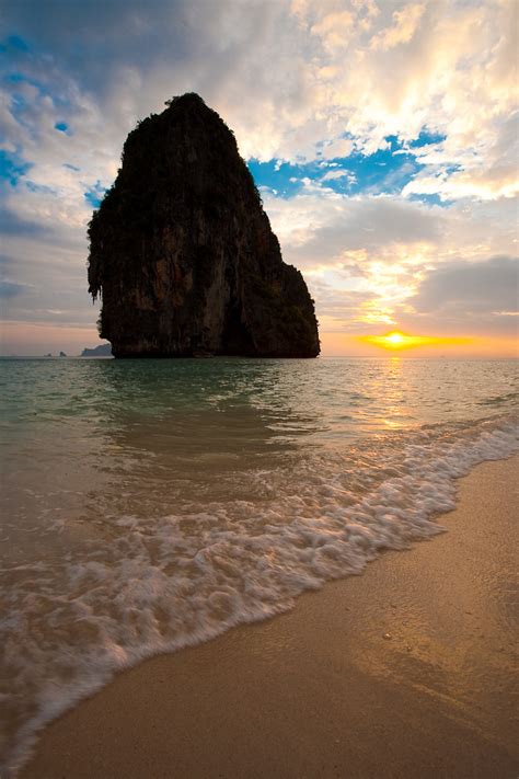Railay Beach Mountain A Gentle Waves Breaks On The Shore At Sunset In