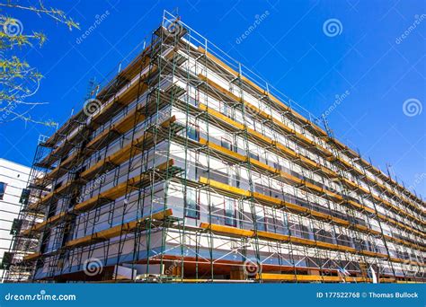 Multi Story Residential Building Under Construction With Scaffolding