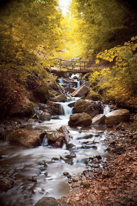 Waterfall With Rocks In A Autumn Landscape Stock Image Image Of Creek