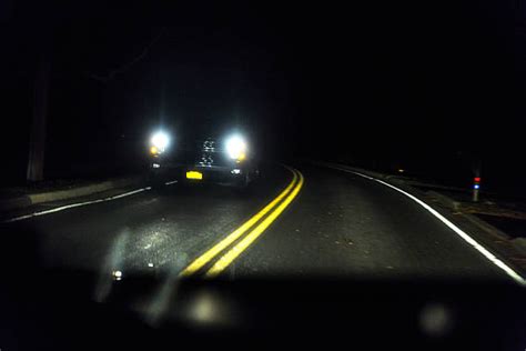 Car Headlights At Night Stock Photos Pictures And Royalty Free Images