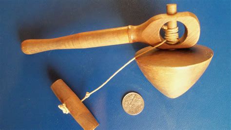 Turn a wood spin top. Vintage wooden pull string spinning top