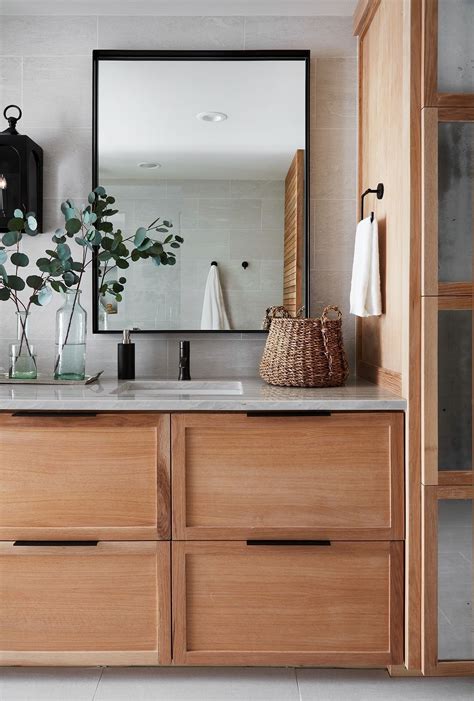 Mixed metals in a bathroom boasting an elegant appeal from a silver arch mirror and brass sconces above a white washstand with a nickel faucet. BEAUTIFUL FARMHOUSE BATHROOM MIRRORS LIGHTING REMODEL ...