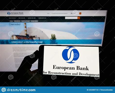 Person Holding Mobile Phone With Logo Of European Bank For Reconstruction And Development Ebrd