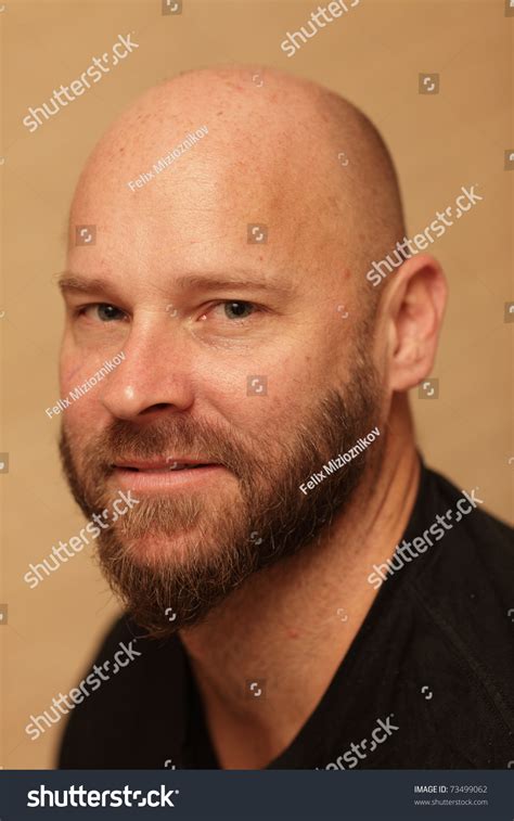 Headshot Of A Bald Man In A Black Shirt Stock Photo 73499062 Shutterstock