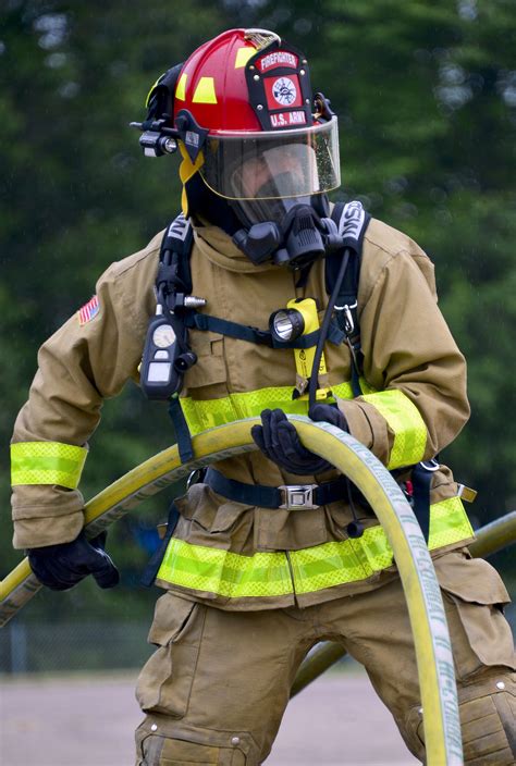 Nebraska Army National Guard Sgt Marco Flores Holds A Fire Hose During