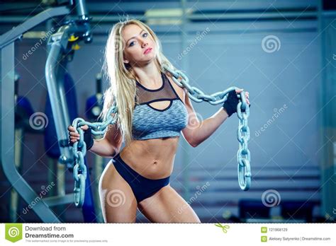 Young Woman Doing Exercises With Heavy Chain In Gym Classic