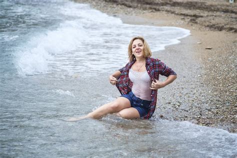 Wet Girl Sitting In The Water On The Sea Beach Stock Image Image Of