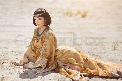 Beautiful Woman Like Egyptian Queen Cleopatra Laying In Desert Outdoor Stock Image Colourbox