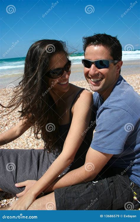 Happy Couple Sitting On The Beach Stock Image Image Of Looking