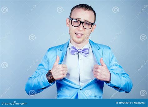 Portrait Of A Young Man Nerd Gay With Glasses In A Stylish Suit And