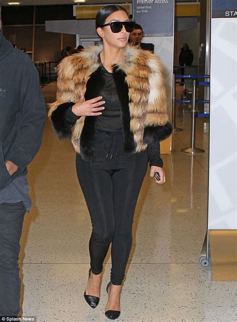 Kim Kardashian Flashes Cleavage As She Dons Sheer Top And Fur Coat